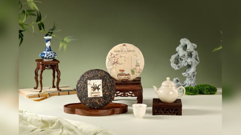 Chinese tea set with pu-erh tea cakes, teapot, and vase