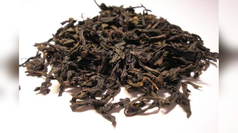 Dried Dahongpao oolong tea leaves, showcasing their dark, twisted appearance.