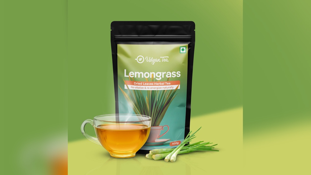 Udyan Tea Lemongrass Herbal Tea pouch with a cup of tea and fresh lemongrass stalks.