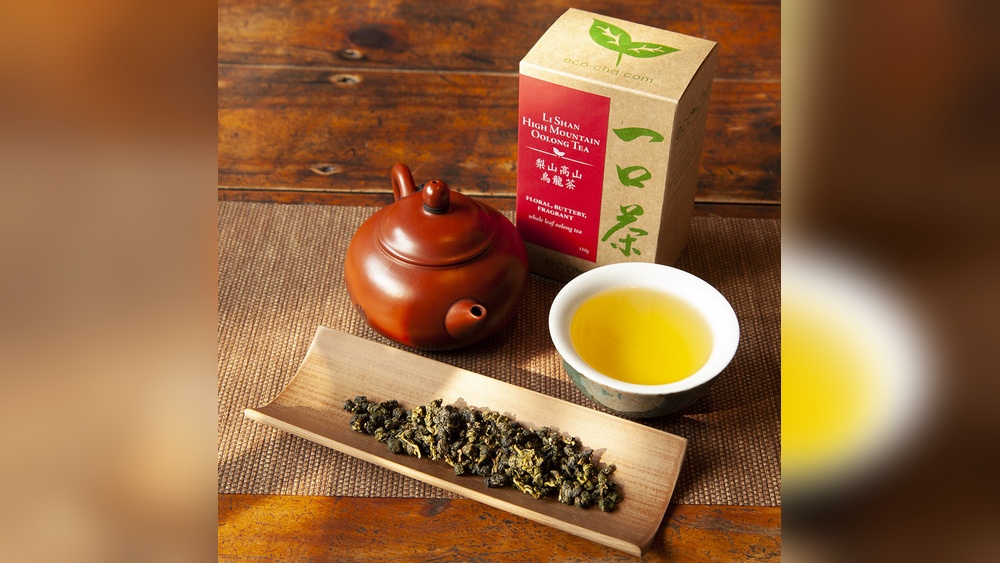 La Shan High Mountain Oolong tea set: teapot, cup, and dry leaves
