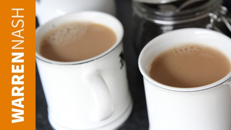 Two mugs of tea with milk, one in the foreground, with WARENNASH text overlay.