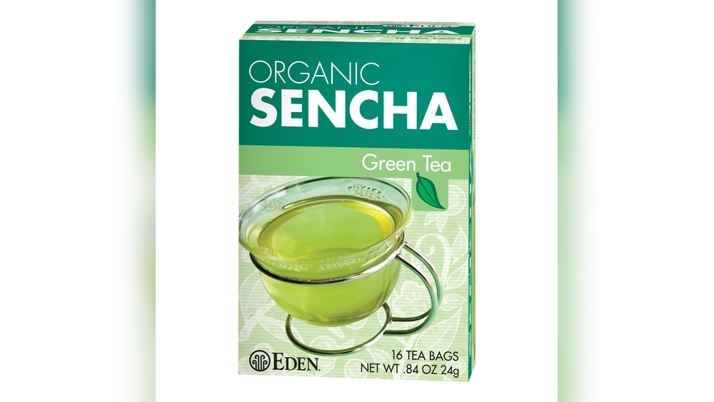 Box of Eden Organic Sencha Green Tea with a cup of brewed tea