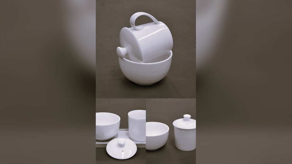 White ceramic tea tasting set with cups, bowls, and lids