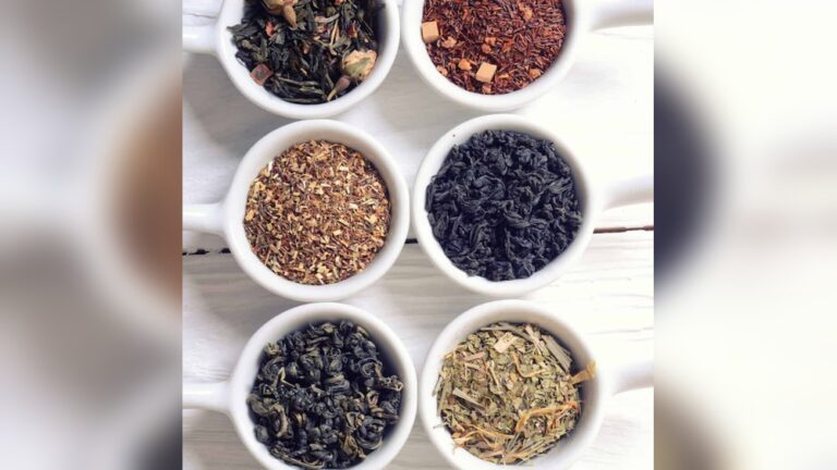 Six white cups filled with various loose leaf teas for premium tea blends.