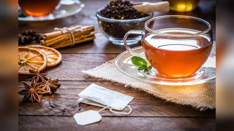 Herbal tea with cinnamon, star anise, and dried orange slices for wellness.