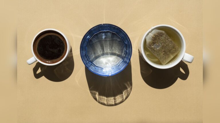 Coffee, water, and tea in cups and glass, illustrating drinking coffee and tea in the same day.